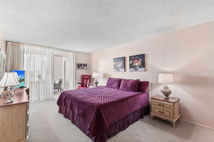 PRIMARY BEDROOM EASILY ACCOMMODATES THE KING-SIZE BED