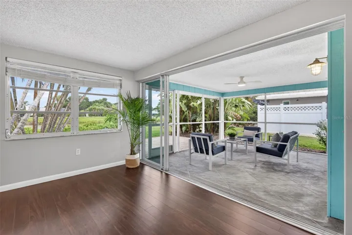 Sliding Glass Doors Lead to Lanai Overlooking Lake