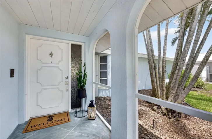Front door with screened in entry way