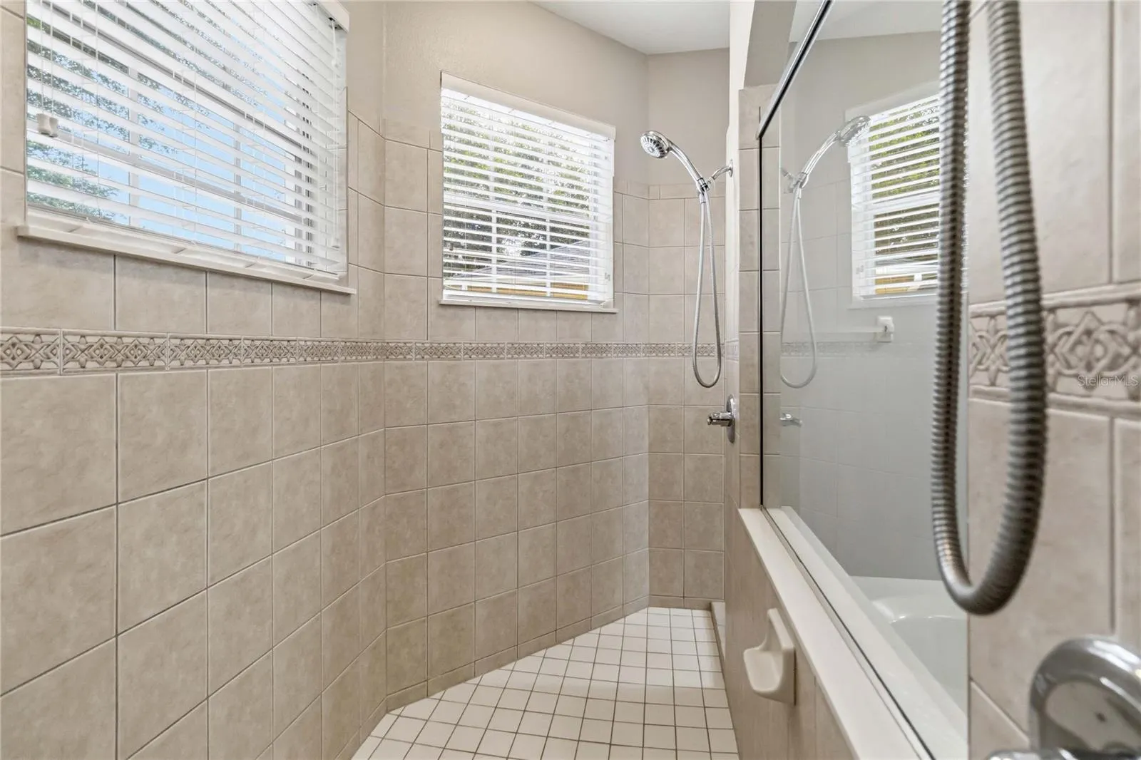 Oversized shower with two shower heads