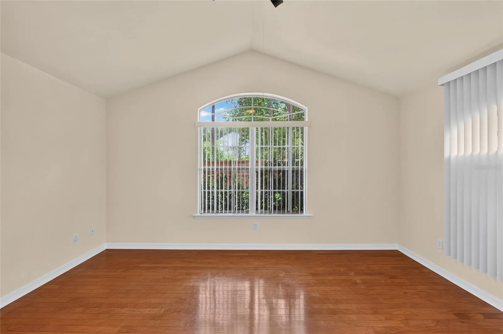 PRIMARY BEDROOM HAS VAULTED CEILINGS