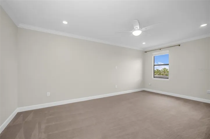 Flex room that can serve as a game room, theater, playroom or craft space.