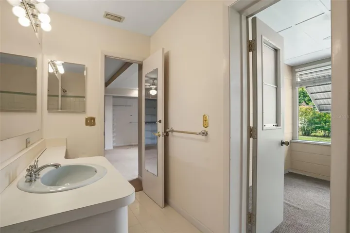 primary bath w/ exit to storage RM and backyard