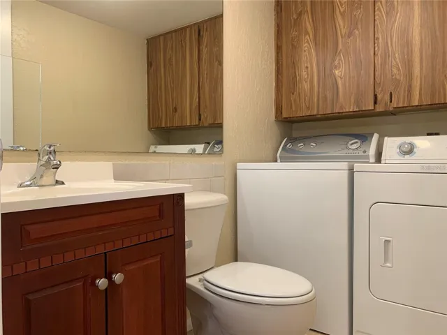 1/2 BATH DOWNSTAIRS + LAUNDRY AREA