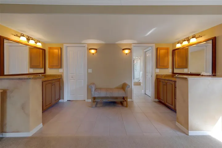 Double vanities and a seat area