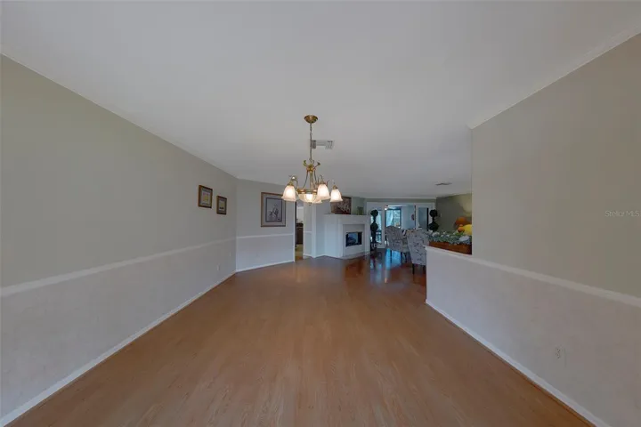 Reverse view of the formal dining leading into the formal living room
