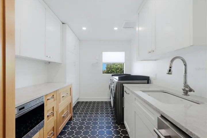 Laundry Room / 2nd Kitchen with ice make and refrigeration drawers & pantry closet