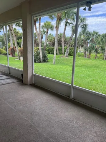 Large covered lanai and beautiful backyard to green area and pond behind.
