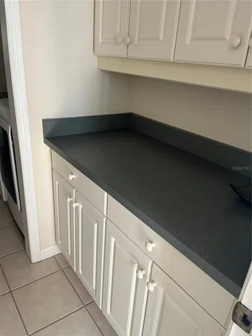 Extra counter space/work-space and cabinets.