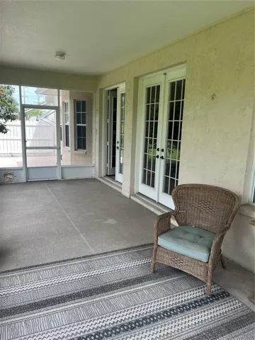 French doors from lanai to living area.