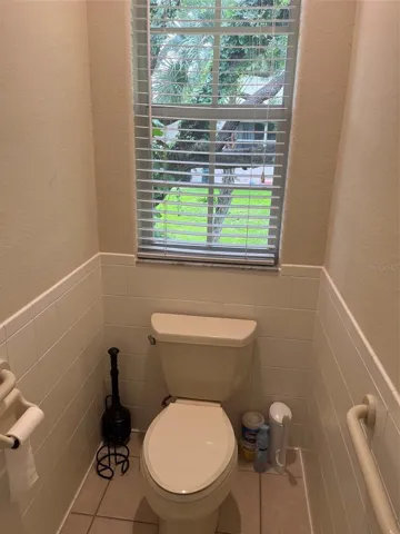 Master bathroom water closet with view.