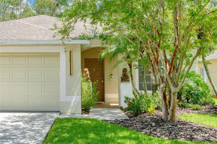 Mature landscaping with fruit trees and lush surroundings