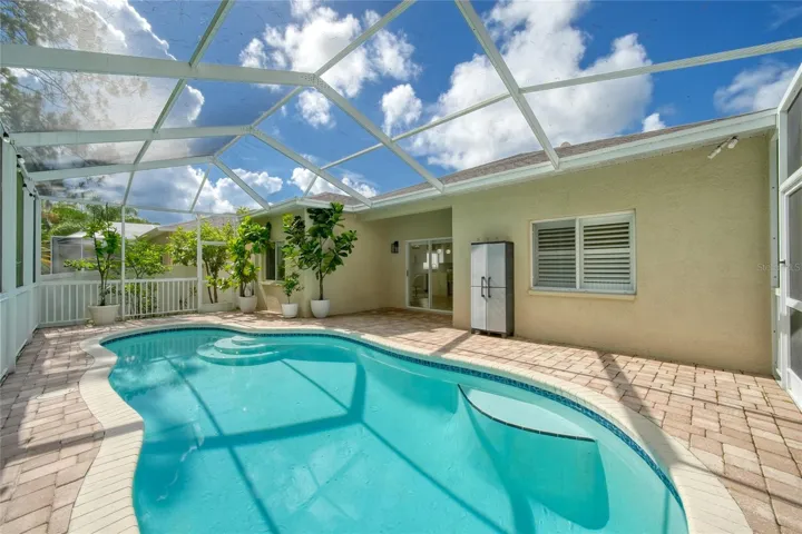 Screened pool overlooking a private, conservation-style setting