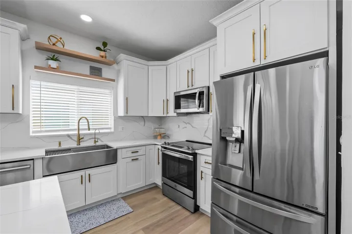 Kitchen with Quartz countertops and backsplash