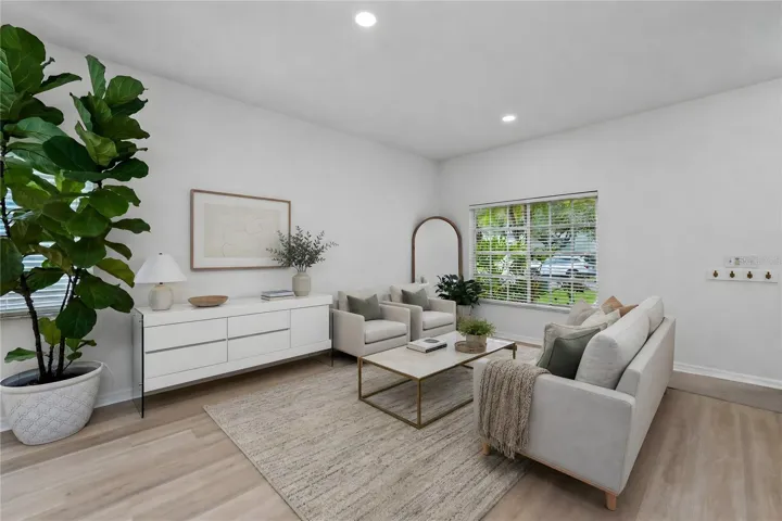 Light-filled living space with updated flooring and seamless flow
