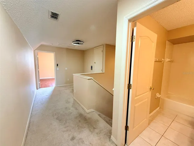 loft and upstairs bathroom hallway