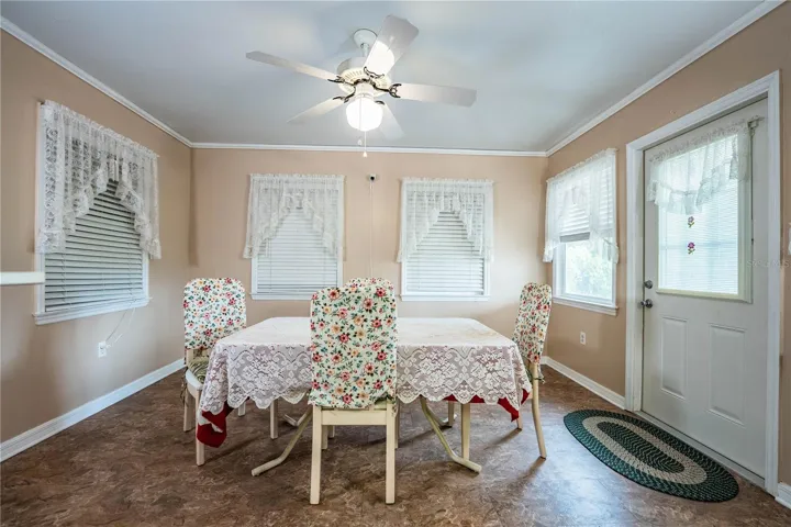 Florida room, formally back porch; used as dining room