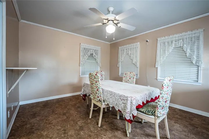 Florida room, formally back porch; used as dining room