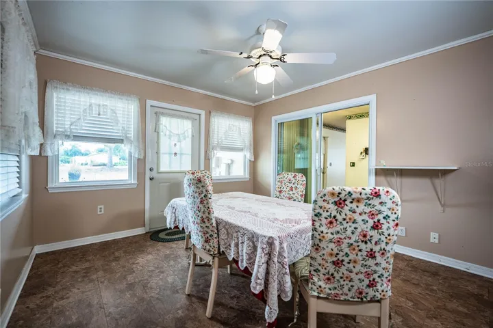 Florida room, formally back porch; used as dining room