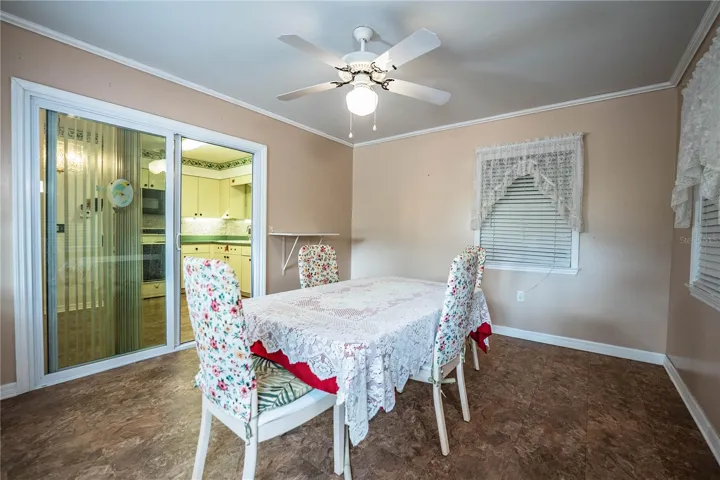 Florida room, formally back porch; used as dining room