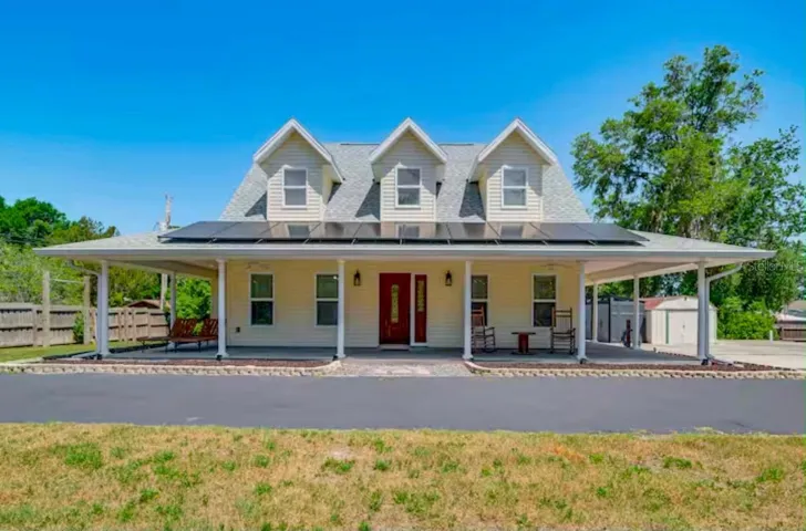 Farm Style home with porch on 3 sides.