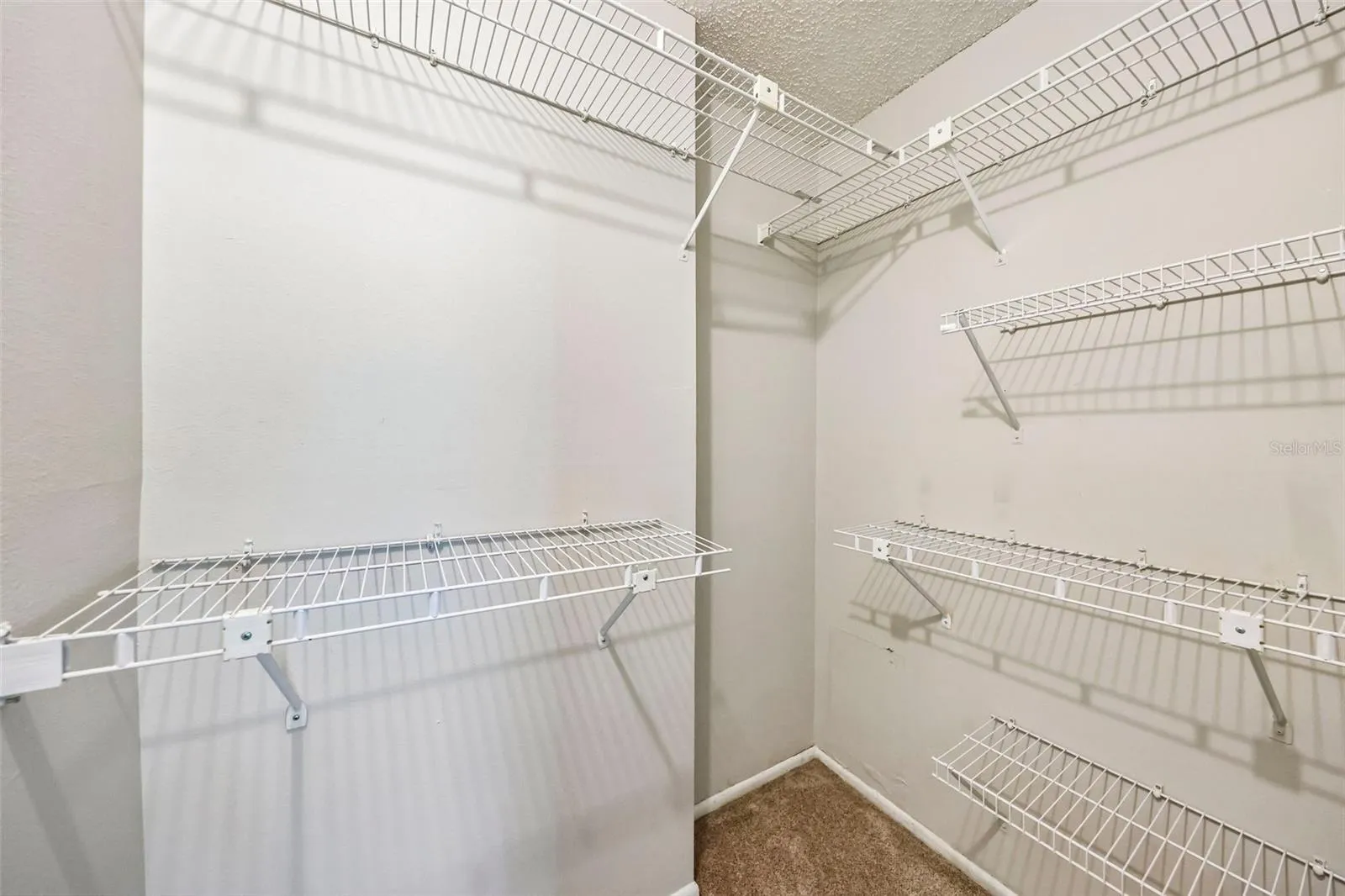 Primary bedroom walk-in closet.
