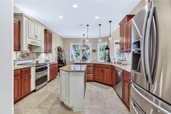 kitchen opens to breakfast & looks out back