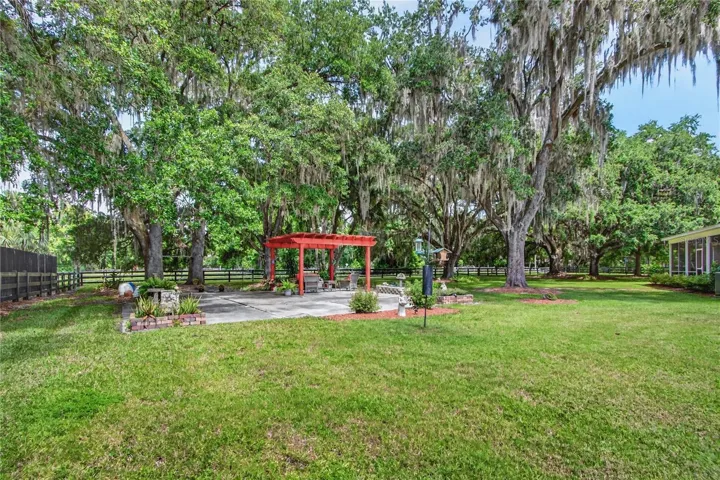 12 to 15 mature, well cared for native Florida oak trees line this property!  Wow!!!!