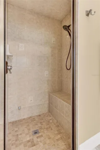 good sized, completely tiled shower