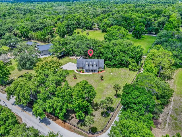 this custom home is perfectly positioned on the property