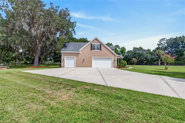 level, mostly cleared property with some landscaping & trees