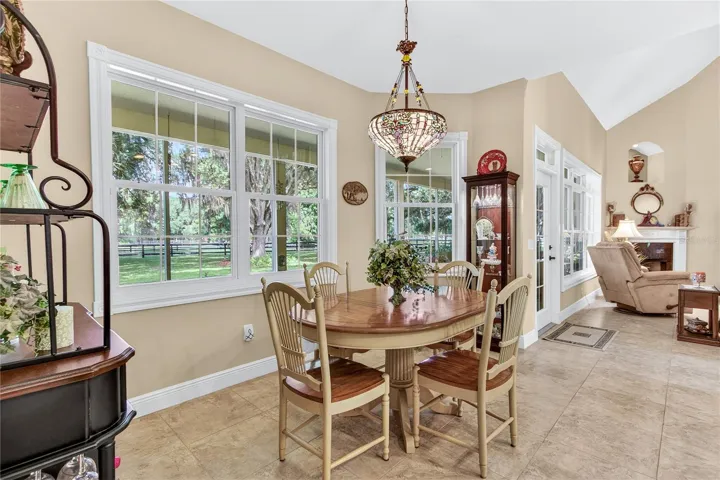 6 large windows + french door & beautiful tile.
