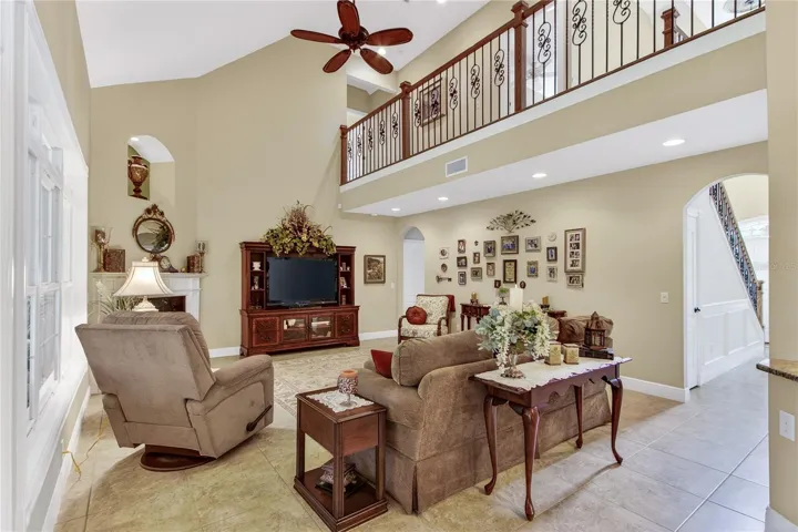 living room opens to upstairs loft hallway; gorgeous railing