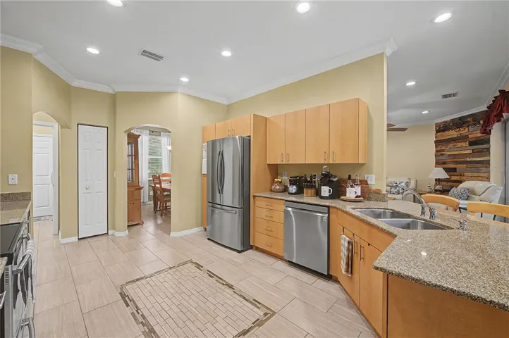 Granite Countertops, Crown molding, Stainless Steel Appliances and tile flooring.
