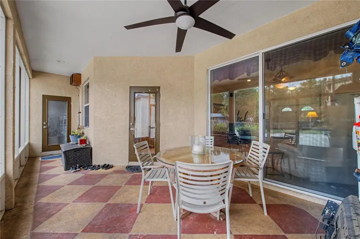 Rear covered patio with fan.