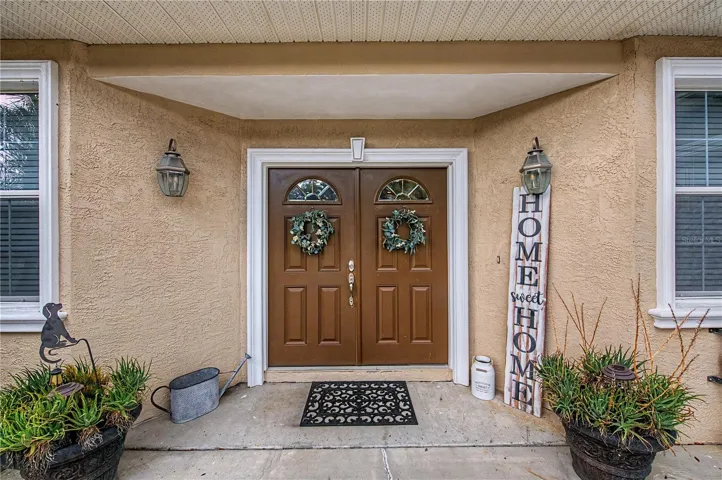 Double Front Doors, almost an acre of land -  very private, no HOA or CDD fees.