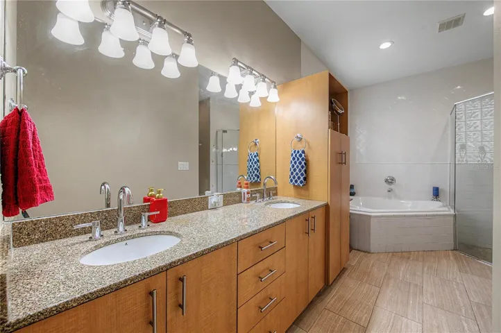 Master Bathroom double vanity, tile flooring, new hardware.