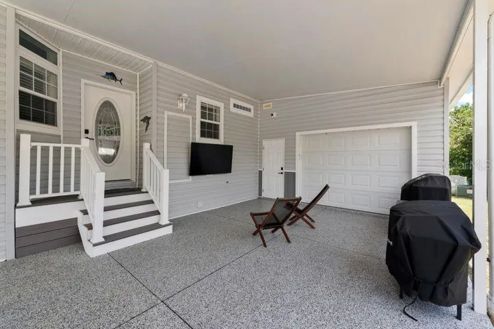 Carport/grill/ seating and TV