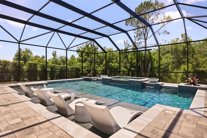 Resort-Style saltwater pool and spa with retractable movie screen and projector