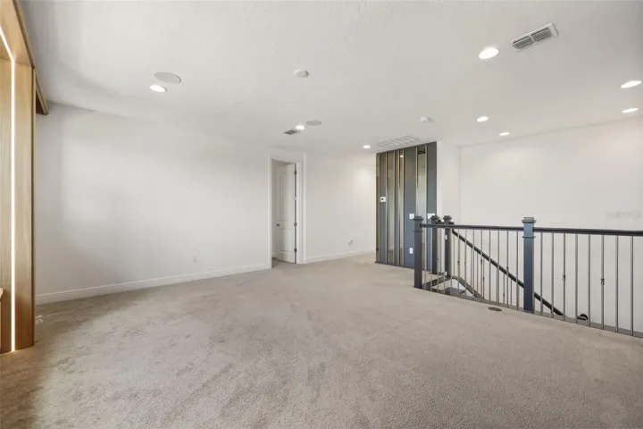 Upstairs bonus room with custom built-in