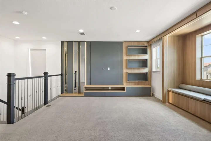 Upstairs bonus room with custom built-in