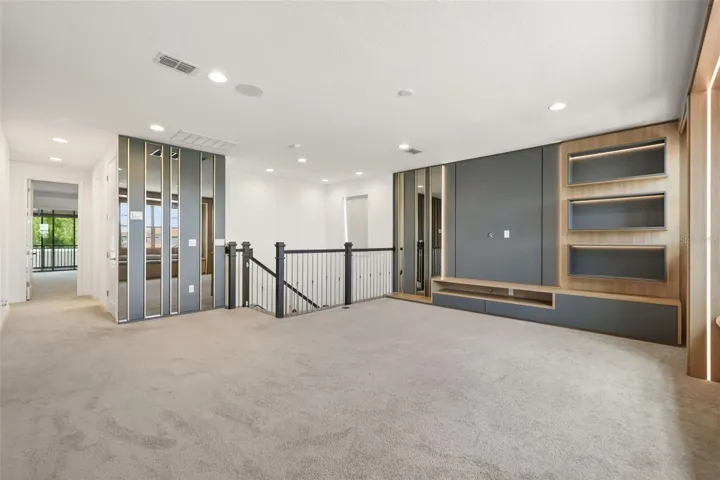 Upstairs bonus room with custom built-in