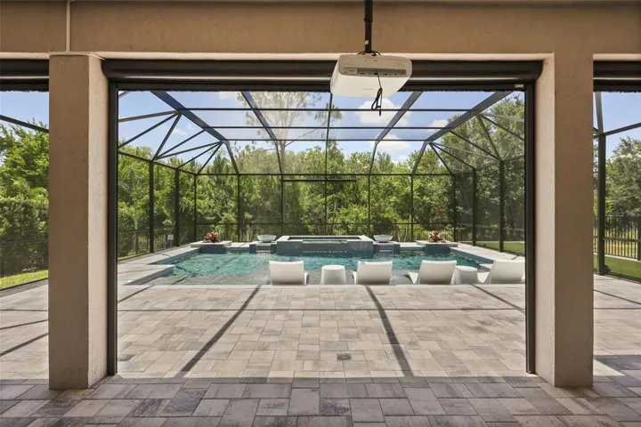 Resort-Style pool with projector and retractable movie screen