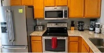 Kitchen - stainless steel - upgraded granite counters