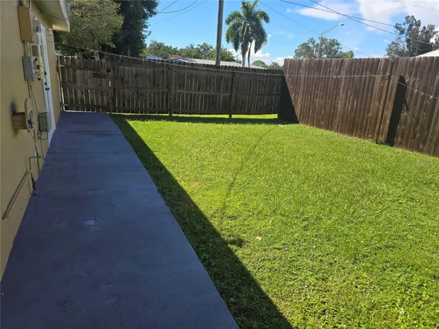 LEFT SIDE REAR ENTRANCE TO BACKYARD