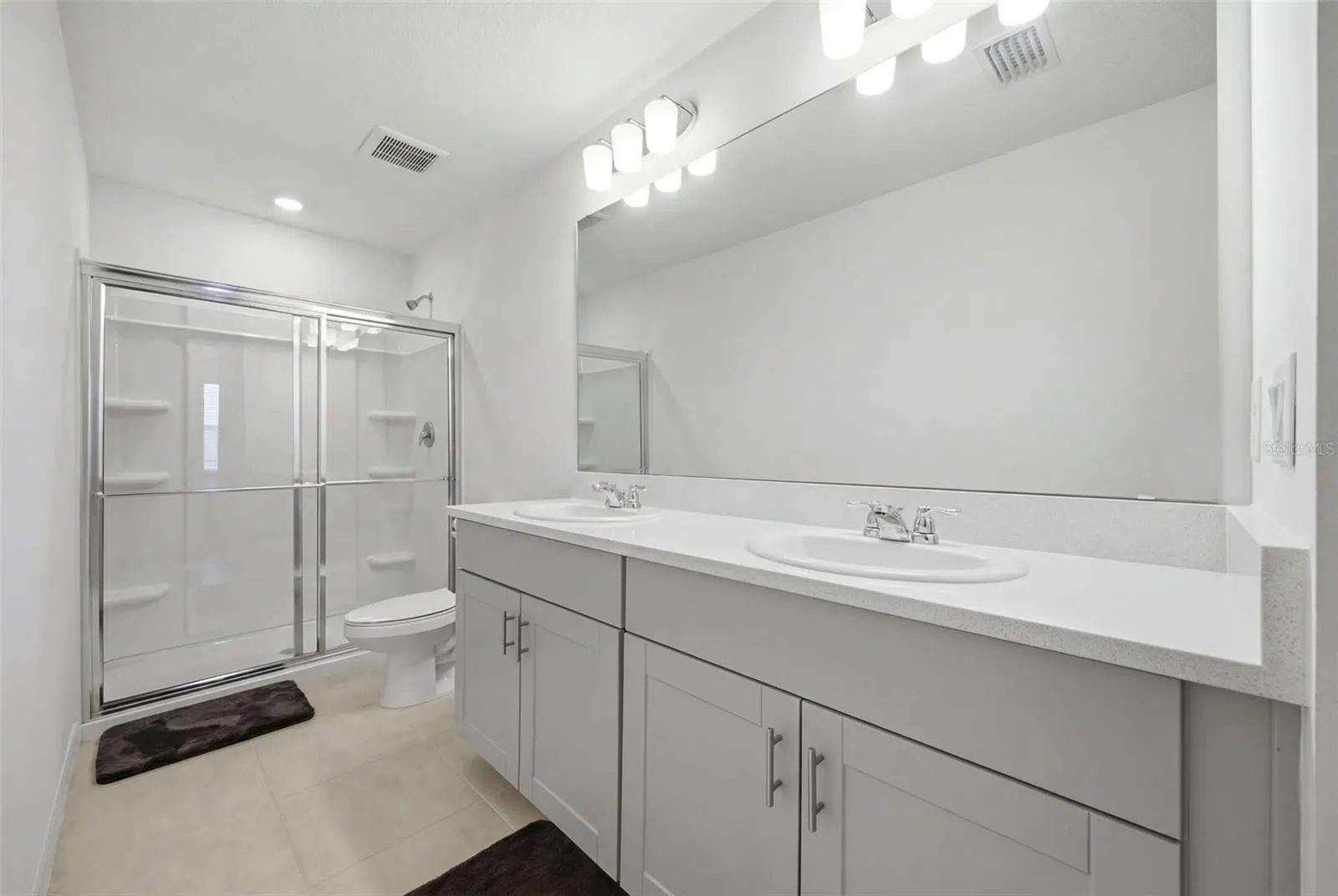 Primary Bathroom with Dual Sinks and Walk-In Shower
