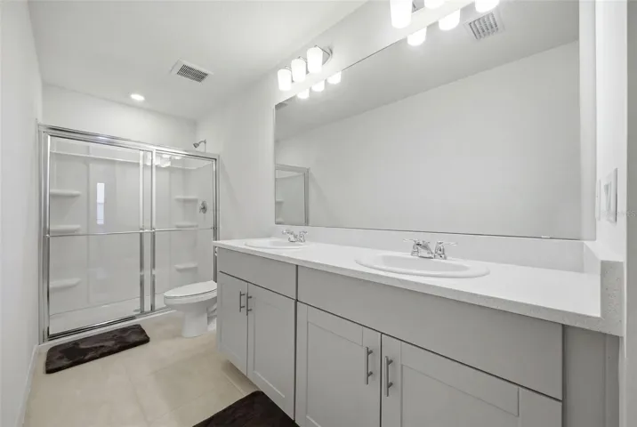 Primary Bathroom with Dual Sinks and Walk-In Shower
