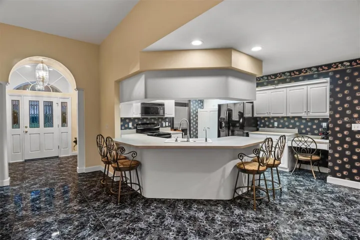 Kitchen with lots of breakfast bar space for eating.
