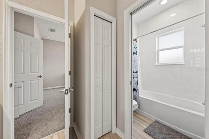 Linen closet and water closet with pocket door