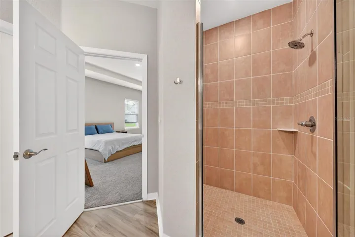 Primary ensuite featuring walk-in shower